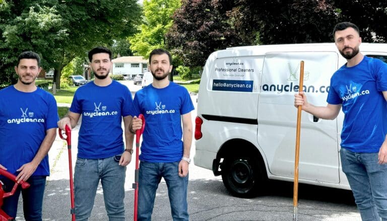 AnyClean crew holding cleaning tools
