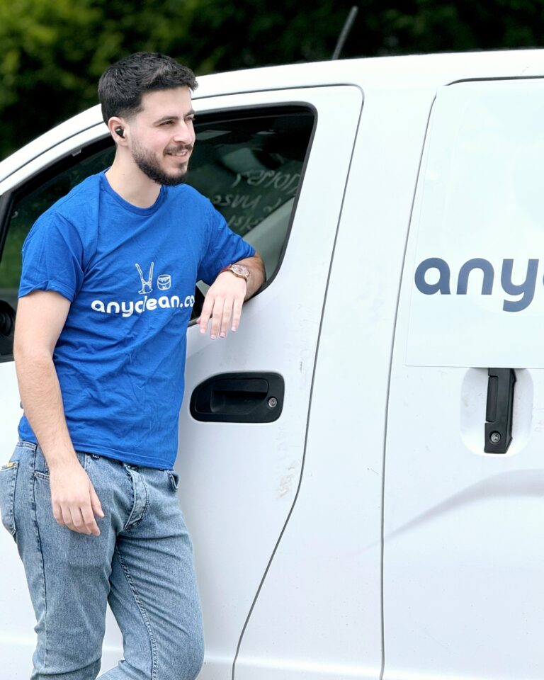 AnyClean cleaner leaning on the van