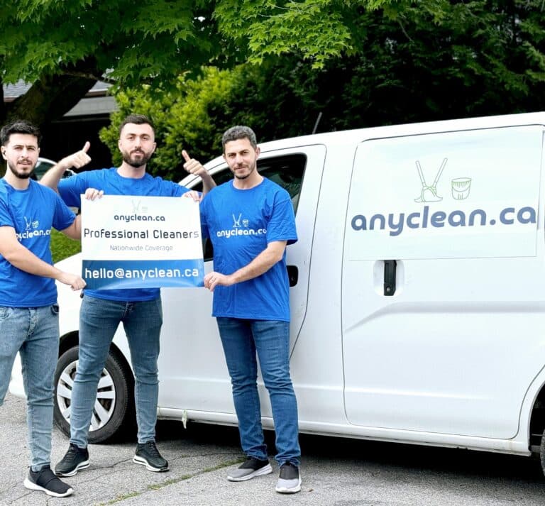 AnyClean cleaners serving Edmonton: team holding the AnyClean sign